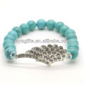 Turquoise 8MM Round Beads Stretch Gemstone Bracelet with Diamante alloy Wing Piece